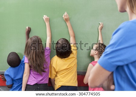 The students writing on the blackboard