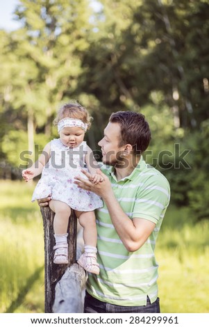 Dad support baby daughter, father's love
