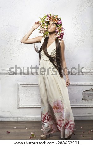Beautiful lady with  flowers on a head