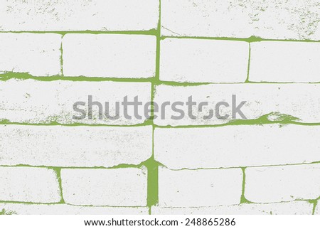 white brick and green background
