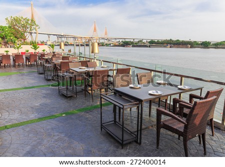 modern table of the restaurant and the nice view beside river