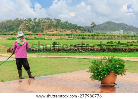 CHONBURI -MAY,14:The gardener is pouring the trees.This place is preparing for visiting at 1000 am everyday.Many tourists come here to take photo  in holiday\