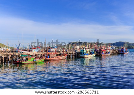 SATTAHEEP CHONBURI - JUNE,12 : The group of fishing boats are mooring at the old port. They are waiting for go out when the wind coming. This is the nice view of fishing villages.THAILAND JUNE,12 2015