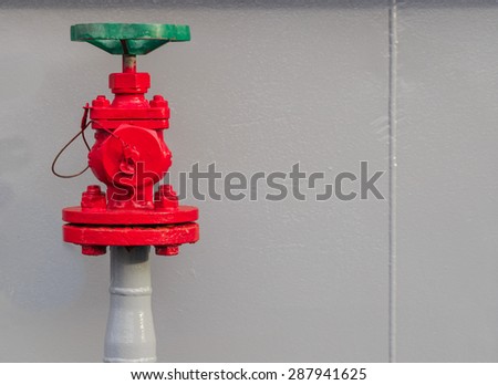 green valve and red water regulator pump on board navy ship