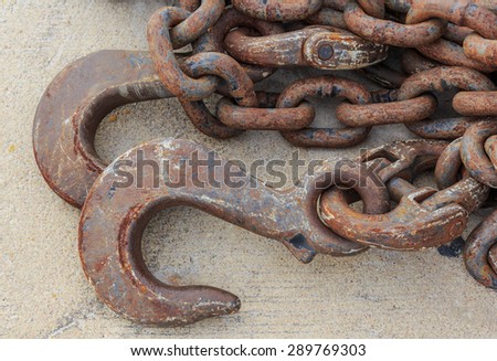 iron hook and chain line on the floor in close up