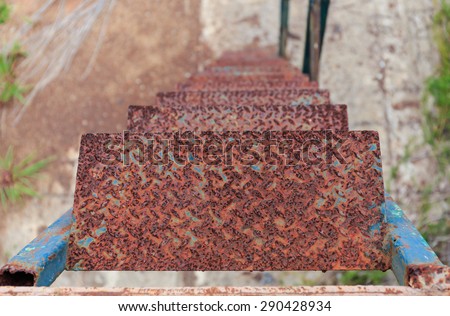 rusty iron stairs step down in close up