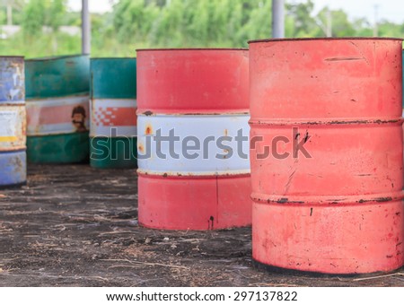 old colorful iron rusty barrel drum in factory