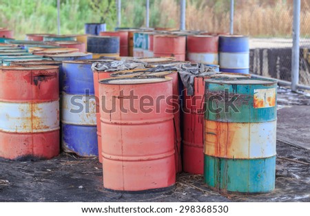 PATTAYA,THAILAND - JULY 20, 2015: The rusty oil barrel set in dirty floor in store of factory in Pattaya