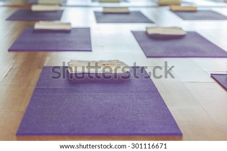 purple yoga mat on the floor