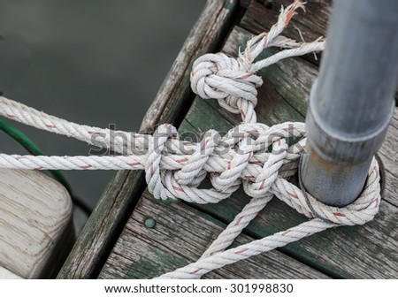 rope tied iron pole