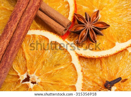 Dry slices of orange, cinnamon, cloves and cardamom