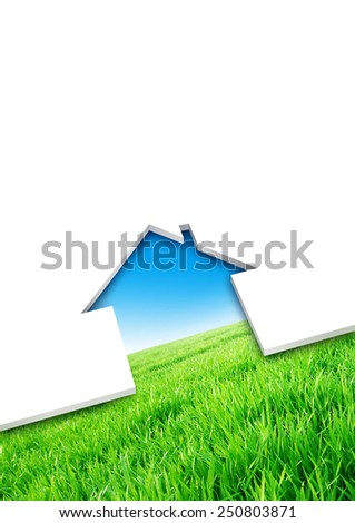 Eco house concept. Cutting of a blank sheet, house shaped above a green field background