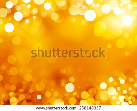Festive sparkling lights. Shiny gold background in sparkles