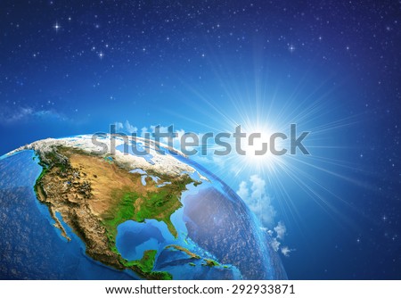 Rising sun over the Earth and its landforms, view of the United States of America. Elements of this image furnished by NASA