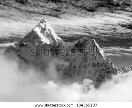 Black and white view of Ama Dablam with and beautiful clouds - Sagarmatha national park - Khumbu valley - Trek to Everest base cam - Nepal