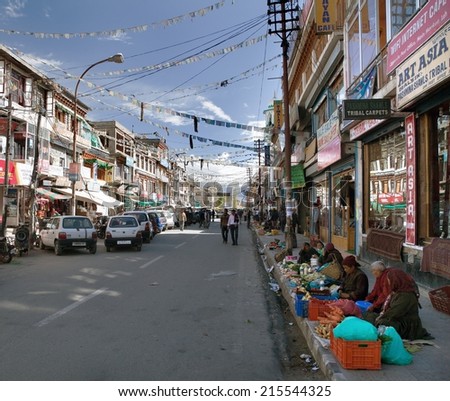 LEH, INDIA - 20th of JULY 2013: Mainstreet of Leh town with sellers of vegetables, Ladakh, Jammu and Kashmir, India