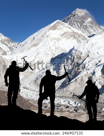 Mount Everest from Kala Patthar and silhouette of men - trek to everest base camp - Nepal