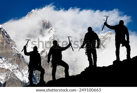 Mount Lhotse and silhouette of men with ice axe - way to everest base camp - Nepal