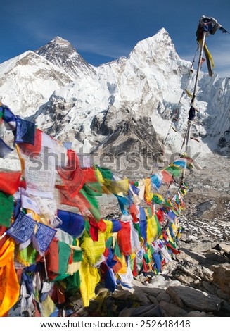 view of Mount Everest with buddhist prayer flags from Kala Patthar, way to Everest base camp, Nepal