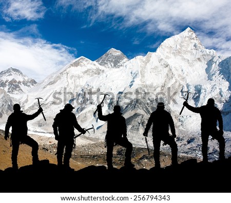 Mount Everest, Lhotse, Nuptse and icefall Khumbu from Kala Patthar and silhouette of climbing men with ice axe in hand - trek to everest base camp - Nepal