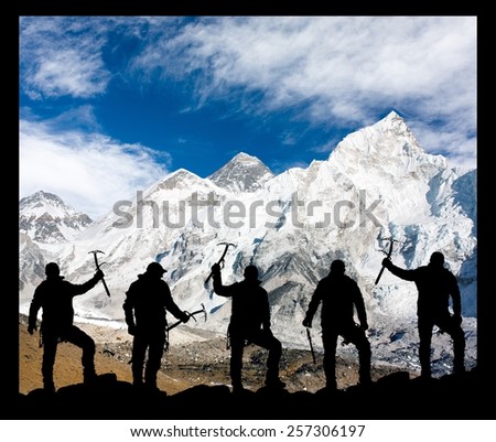 Mount Everest, Lhotse, Nuptse and icefall Khumbu from Kala Patthar and silhouette of climbing men with ice axe in hand - trek to everest base camp - Nepal