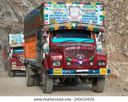 INDIA, LADAKH, CIRCA SEPTEMBER 2013 - Colorful trucks brand TATA in Indian Himalayas on himalayan high altitude road - Ladakh - Jammu and Kashmir