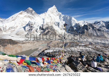 View of Mt. Everest, Lhotse and Nuptse with prayer flags and tourists from Kala Patthar view point near Gorak Shep and Everest base camp, Khumbu valley, Sagarmatha national park, Nepal