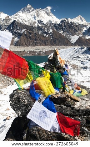 view of Mount Everest with buddhist prayer flags from Renjo La pass - Nepal