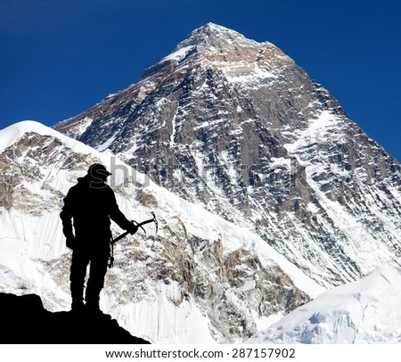Mount Everest from Kala Patthar and silhouette of man - trek to everest base camp - Nepal