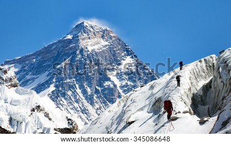 view of Everest from Gokyo valley with group of climbers on glacier, way to Everest base camp, Sagarmatha national park, Khumbu valley, Nepalese Himalayas