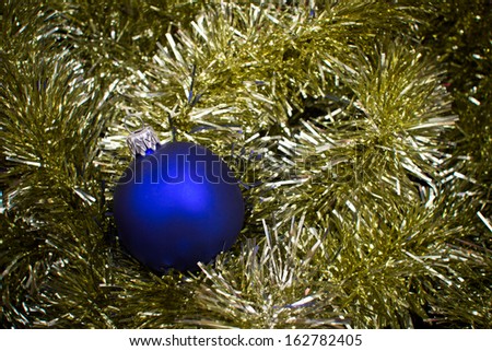 Christmas ball on decorative reflective chain holiday texture