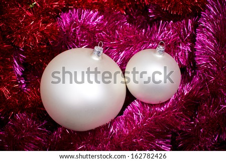 Christmas ball on decorative reflective chain holiday texture
