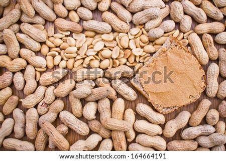 Peanut and butter on slide of bread food texture