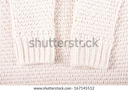 White soft woolen sweater. Fashion texture