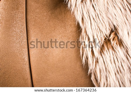 Animal soft and warm fur. Leather jacket texture.