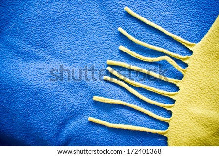 Blue and yellow soft fabric. Sun shape texture