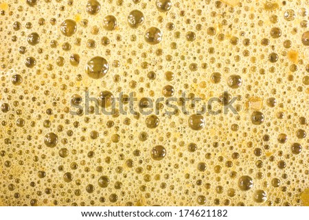Yellow foam with bubbles texture