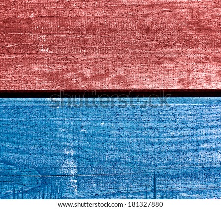 Colored red and blue wooden desk texture.