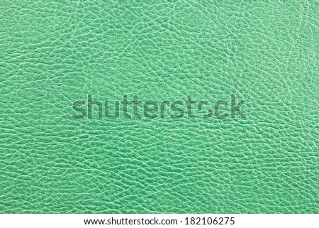 Green leather book cover texture. Closeup detailed.