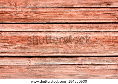 Wooden desks covered with pale red paint texture