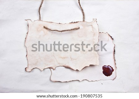 Stained paper with linen rope and sealing wax. White blank message texture.