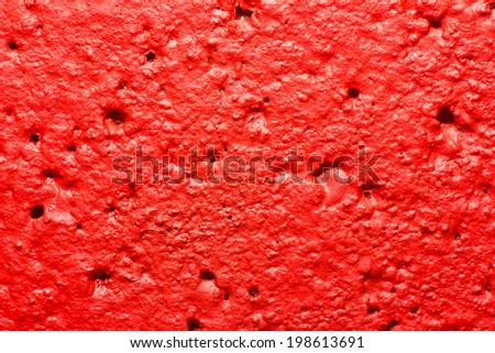 Black and red wall painted with spray - closeup texture.