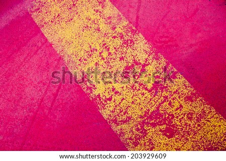 Line layers of paint yellow and red. Old paint peeling texture
