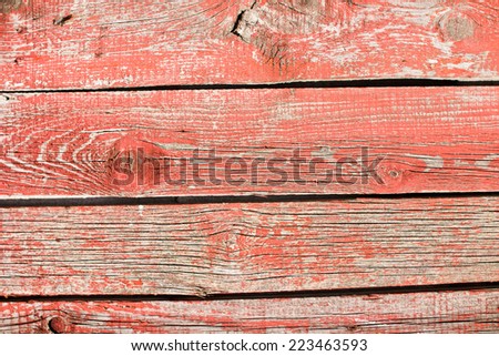 Aged red painted, wooden desks texture.