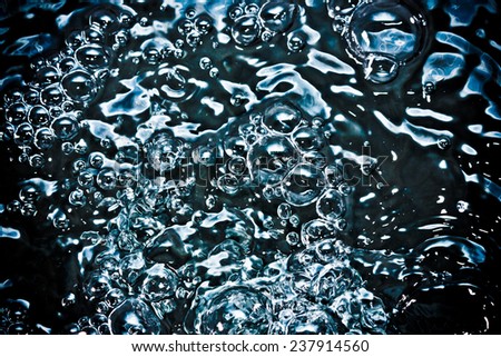 Abstract black water bubble texture.