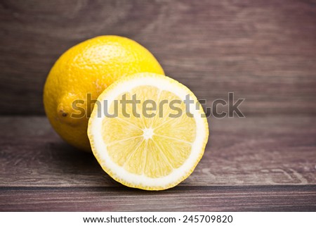 Lemon cut on wooden table.
