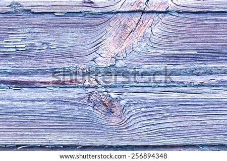 Wooden desks covered with blue peeling paint texture