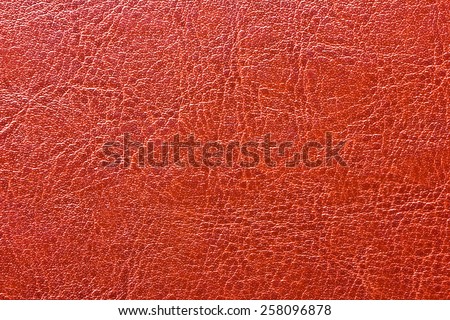 Red leather book cover texture.