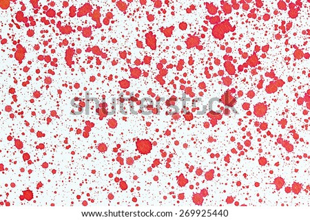 Red ink stains on white paper texture.