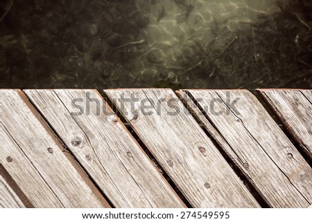 Pier on the lake with water in the background texture.